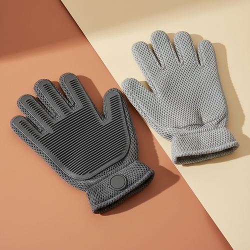 Clean product photograph of the gray 2-in-1 silicone pet grooming glove pair on a terracotta and cream background
